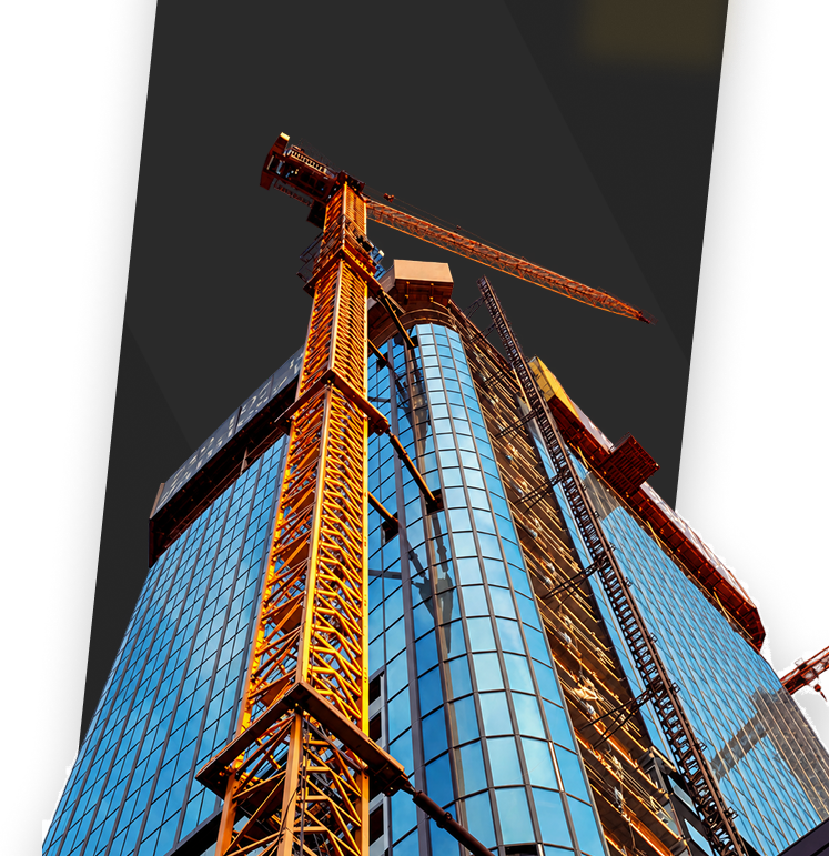 High-rise building under construction with tower cranes